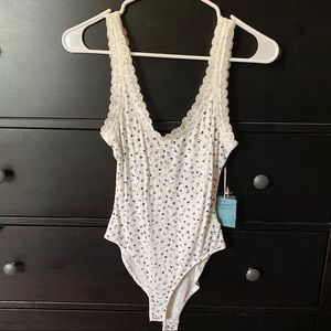 Dainty Ribbed Knit Bodysuit